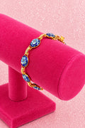 Vintage Gold Tone Link Bracelet Featuring Blue Enamel Floral Cabochons