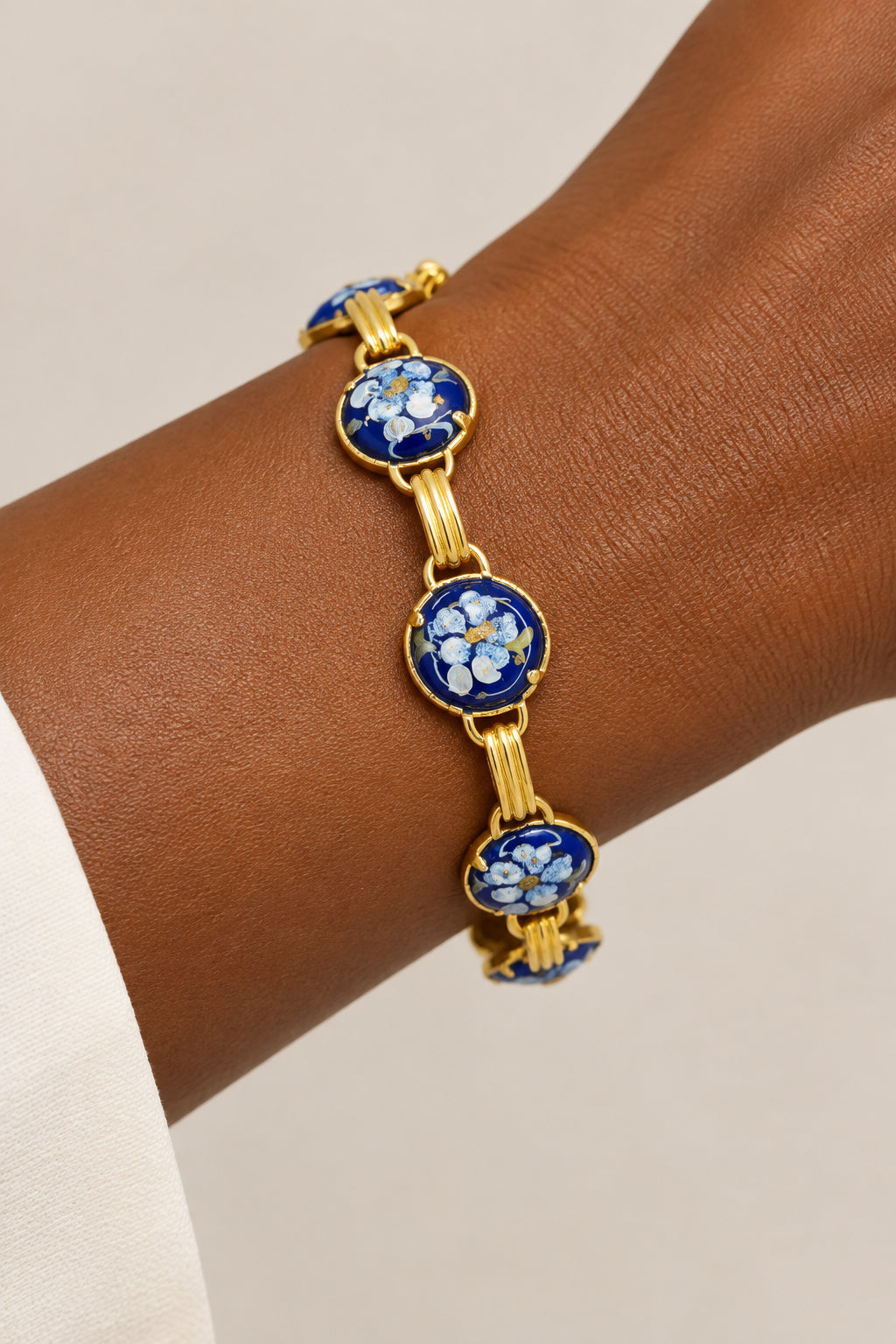 Vintage Gold Tone Link Bracelet Featuring Blue Enamel Floral Cabochons